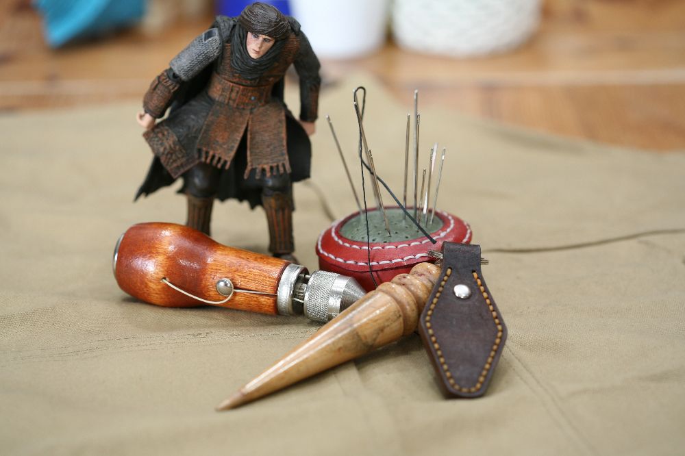 Handcrafted leather keyring with detailed stitching, available in brown and other colours