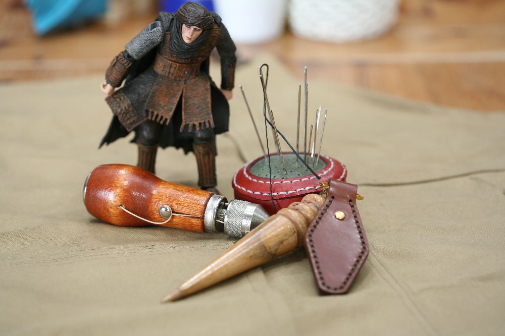 Handcrafted leather keyring with detailed stitching, available in brown and other colours