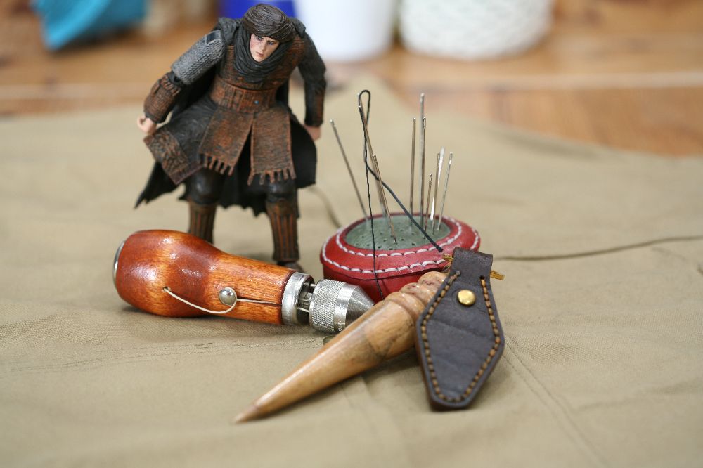Handcrafted leather keyring with detailed stitching, available in brown and other colours